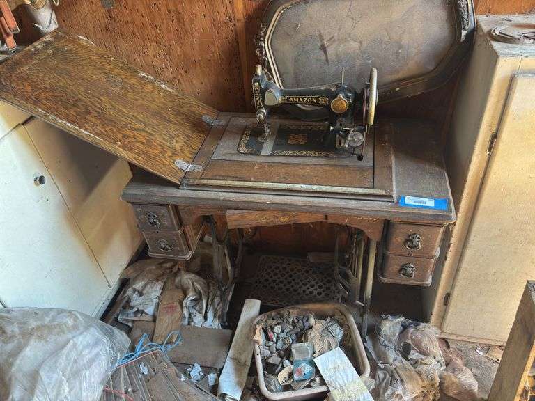 Beautiful antique treadle sewing machine with Amazon machine image