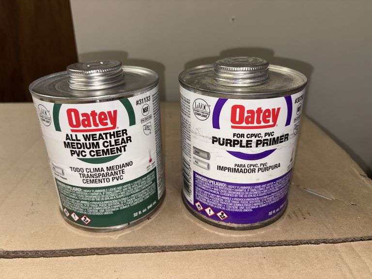 (1) 32oz can Oatey all weather medium clear PVC cement and (1) 32oz purple primer image