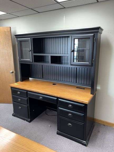 24D x 68L x 72H two piece credenza with hutch on top Has flip down keyboard tray, three drawers on left side and single door on right . Matches desk in lot 11487 image