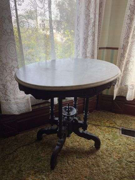 22x29x28H marble top parlor table on porcelain wheels image