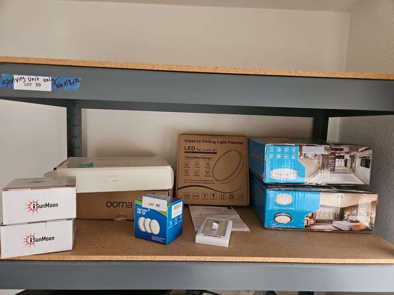 Ceiling Lights (New in Box), iSun Moon Solar Power Gitter Lights (New in Box), Smart Sensor Night Light, Magnifier (Top Shelf on Shelving Unit)