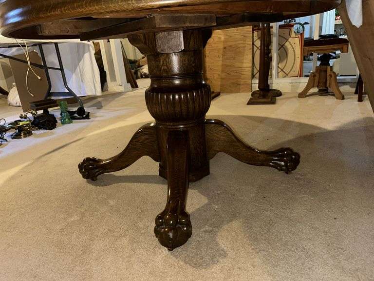 48” round oak table w/ (2) 12" leaves