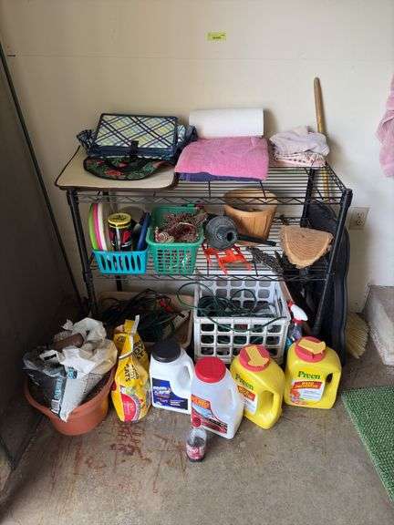 Wire shelf unit and contents includes drop cords, decor, cord wraps, cat litter, Preen, etc image