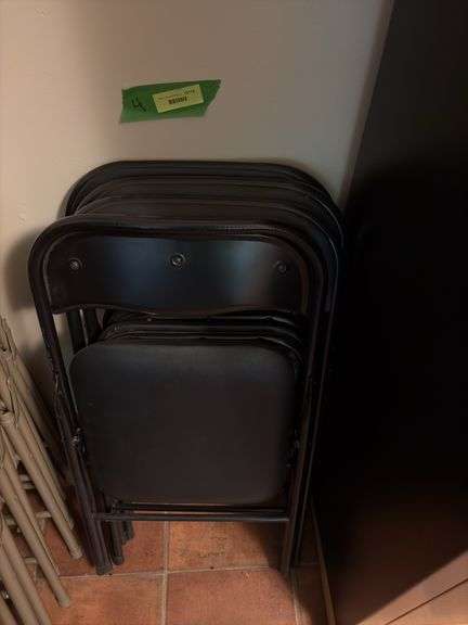 4 black padded back and seat folding chairs image