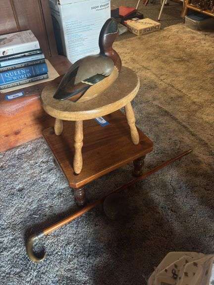 Signed duck decoy, two wooden stools, ornate walking cane, and cast iron cannonball image
