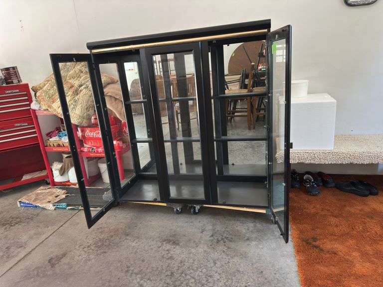 Lighted black hutch top with glass shelves 17D x 48L x 50H Glass shelves are wrapped in house