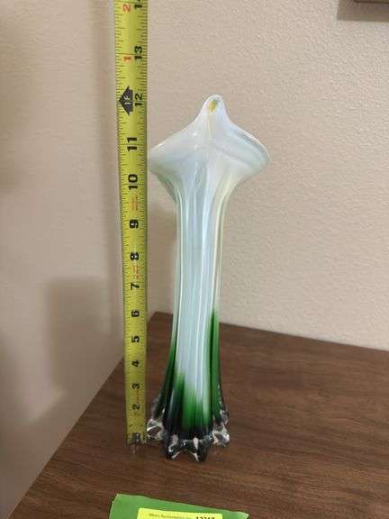 Jack in the Pulpit style glass stretch vase and genuine plastic flowers, not imitation plastic but genuine!!!