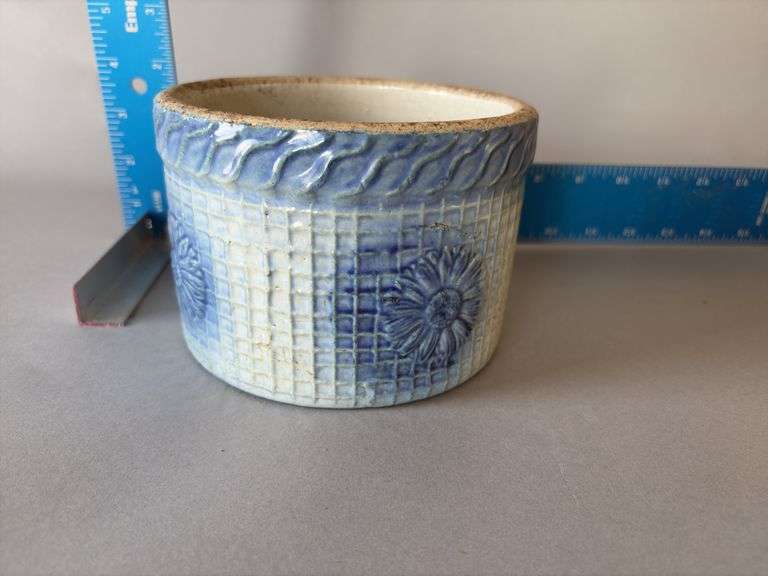 Blue and white pottery butter crock with basket weave pattern and flower design image