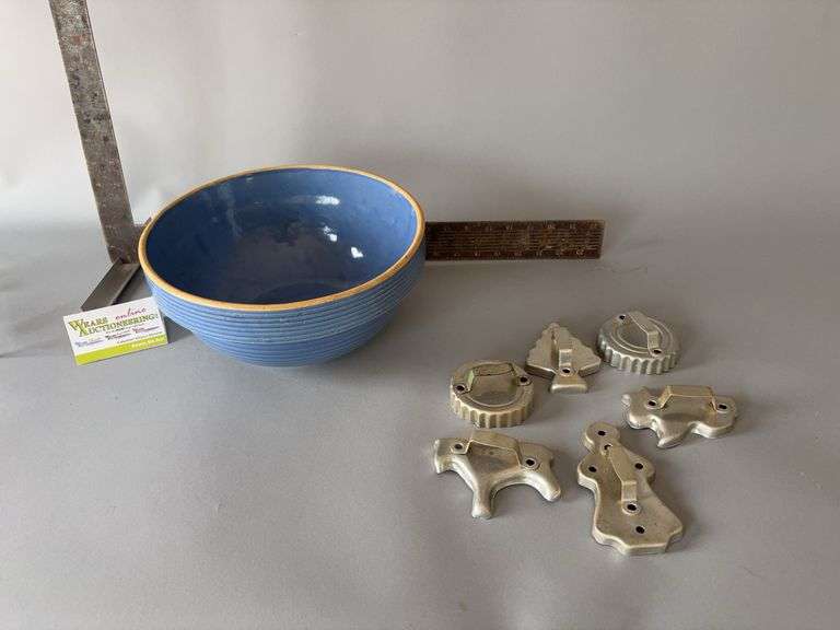11R x 5.25H blue vertical ribbed stoneware bowl with hairline crack and cookie cutters image