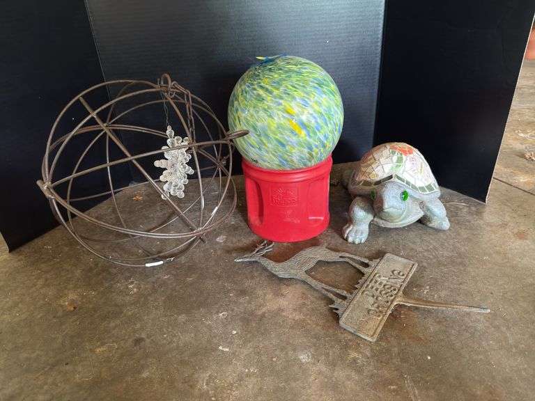 Yard decor includes deer crossing stake, small gazing ball, turtle and wire ball for hanging image