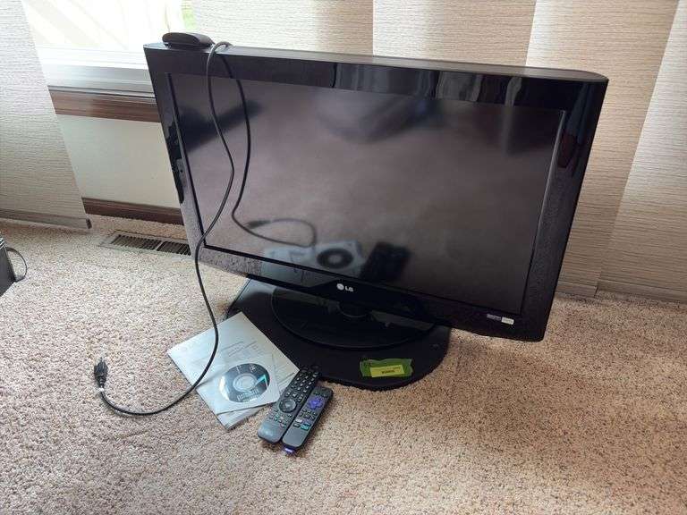 LG 32” flatscreen TV model 32LH20 with Roku image