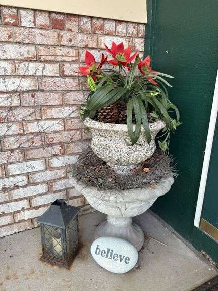 Two cement planters with decor, lantern,  “believe” stone, door wreath image