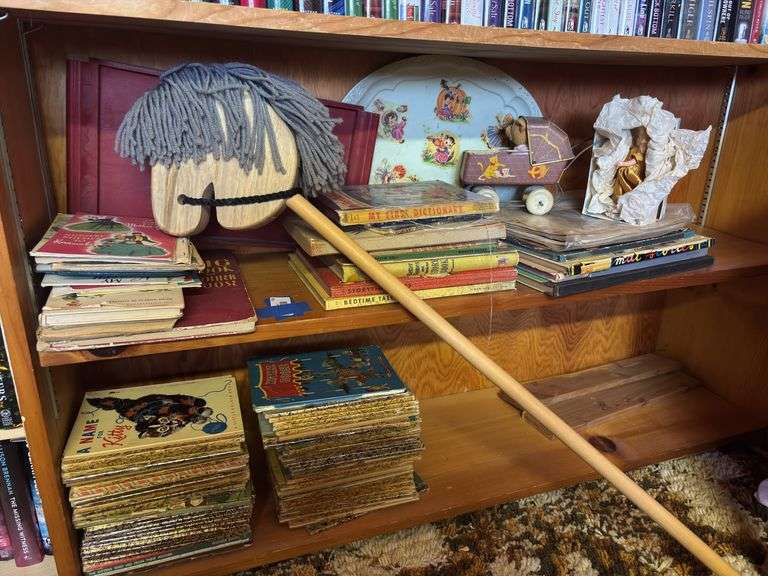 Kids items including lots of vintage and antique children’s books, tin doll wagon, tin tray, large quantity of little golden books image