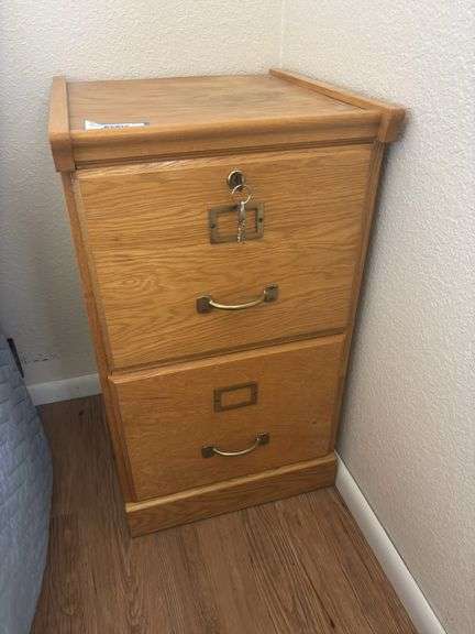 Two drawer oak file cabinet with key image