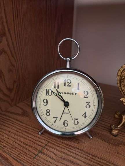 Clocks including a very nice metal ornate wind up clock w/ beveled glass, classic alarm clock