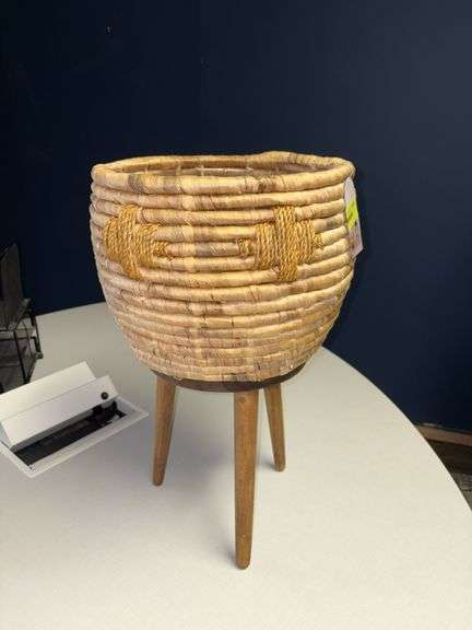 Basket style planter on wooden legs, handmade in Vietnam Approx 22” tall