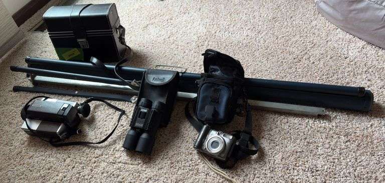 Projector screen, Bushnell 12x32 binoculars, Canon PowerShot A590 digital camera, Kodak XL33 movie camera image