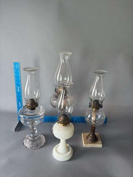 Four kerosene lamps, 1 milk glass font, 1 marble base image