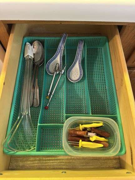 4 kitchen drawers marked "A" with flatware and kitchen utensils