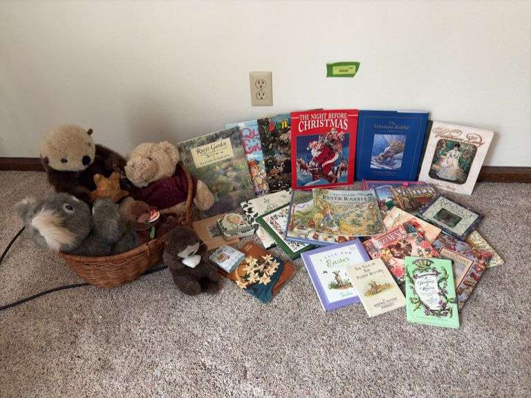 Children’s books and a basket of stuffies image