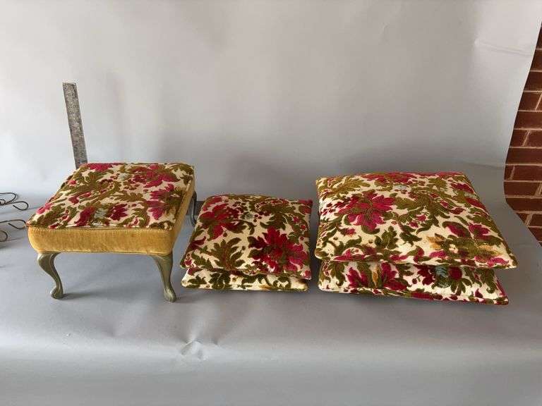 Four throw pillows with matching foot rest image