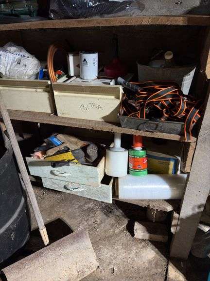 Filters, tie downs, shrink wrap, Painting, etc Bottom 2 shelves left side image