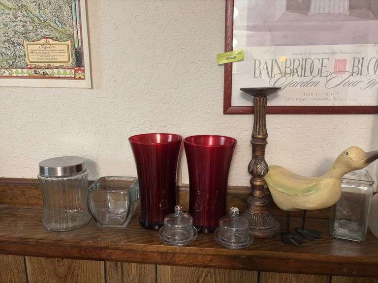 On ledge includes decorative vases, individual cheese bowls, candle holder, a goose and more