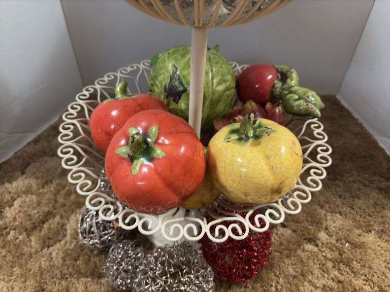 Decorative stand with wire balls and ceramic fruit