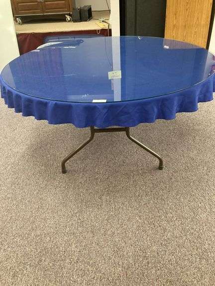 60” Round folding table with glass top and blue tablecloth image