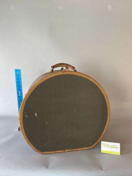 Double sided luggage carrier with furs, appear to be two muffs and two stoles image