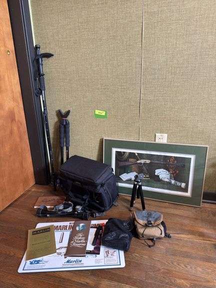 Framed Winchester poster, Marlin reading material, small tripod, Xia Guang anti shock walking stick, Vanquard Scout B62, headlamps, Bushnell 4X Banner scope, Bulldog bag, etc image