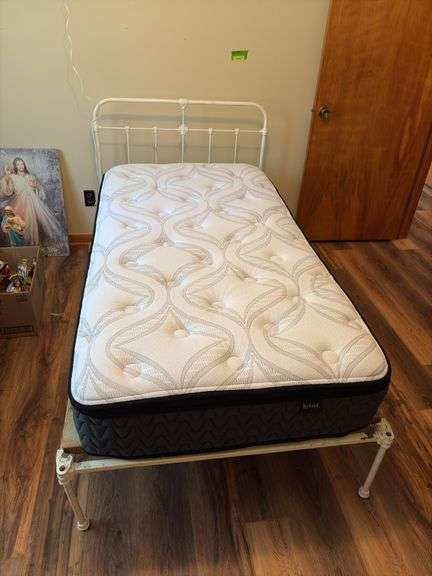 Twin size iron bed frame with Ashley Furniture hybrid mattress image
