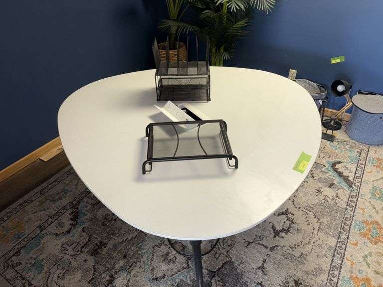 60x29 Formica topped conference  table, egg shaped, with power outlet and office file holders