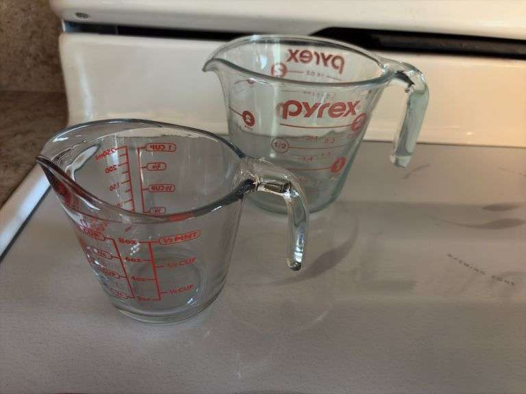 Two glass measuring cups, wine stopper, holiday measuring bowls, pair of stein style S&P shakers