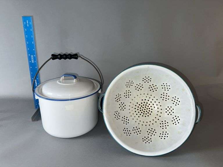 Blue and white footed colander and enamelware pail image