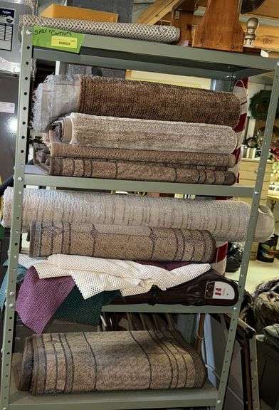 Storage shelf and inventory of rugs image