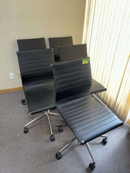 Five rolling adjustable height office chairs, see photos for condition image