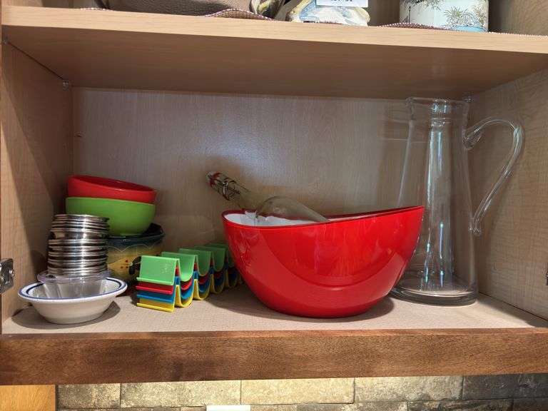 Red plastic bowls, glass tall pitcher, taco holders and salsa bowls, condiments stainless cups