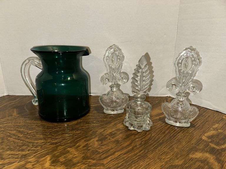 3 glass stopper perfume bottles and large green pitcher
