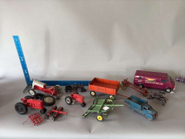Toys include Ertl van, Farm pcs, cast iron train, cast iron fire ladder truck image