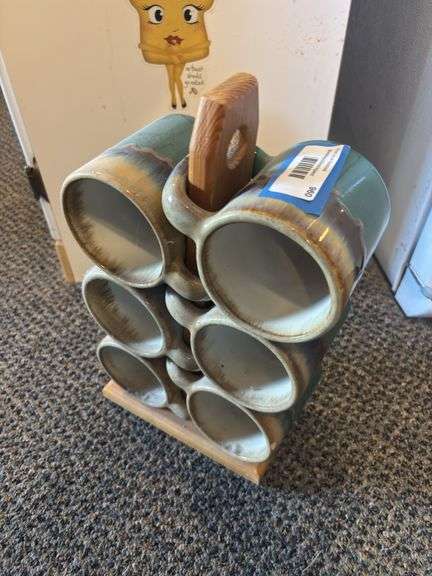 Set of six large ceramic coffee mugs on a wood holder image