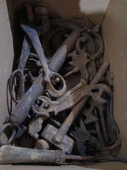 Antique car headlight, ear notcher, horse shoes, horse bits and wrenches etc...