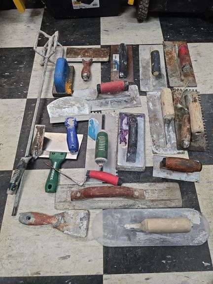 Assorted concrete and tile trowels image