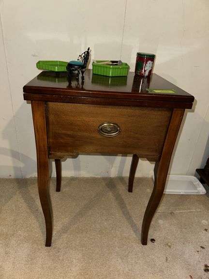 Sewing machine cabinet and notions