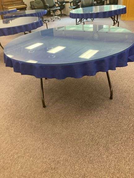60” Round folding table with glass top and blue tablecloth image
