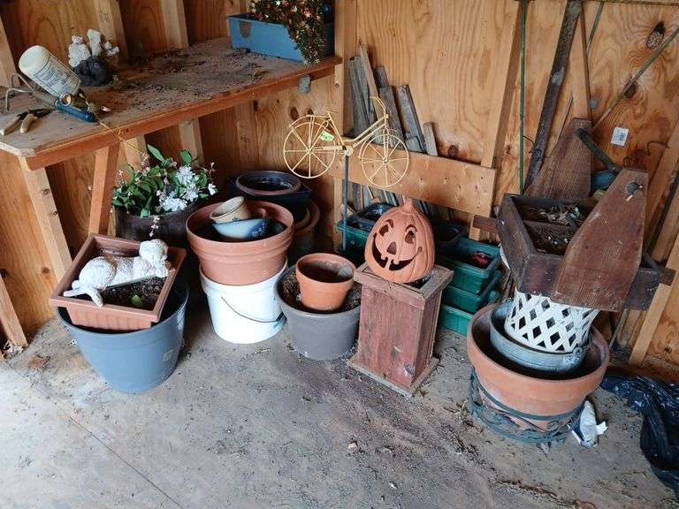 Nail keg and an abundance of planters, pots etc.. image