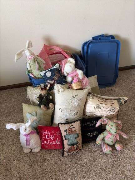 Pillows, stuffed rabbits and two totes to haul them home in
