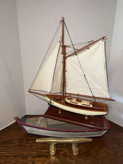 Sailboat and rowboat models and brass tie off image