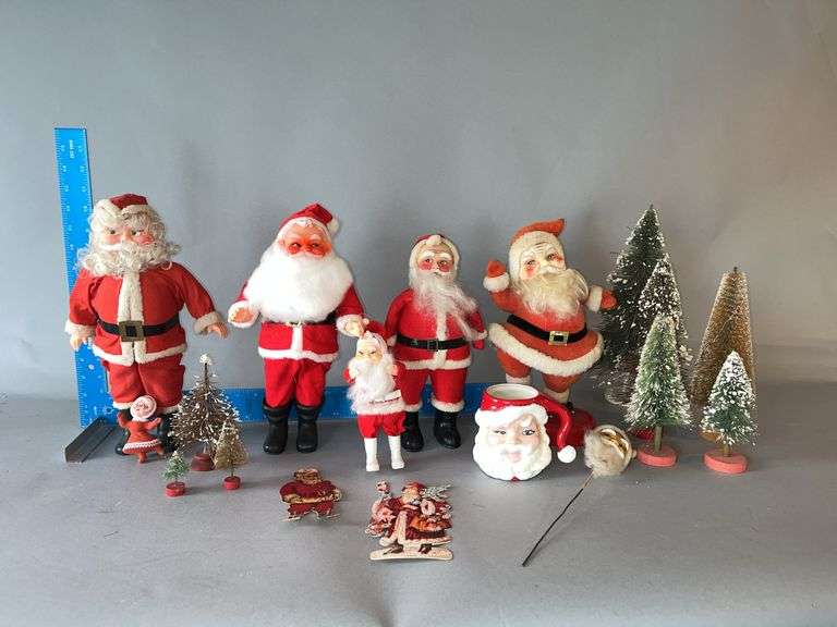 Box of Christmas decor and Santas image
