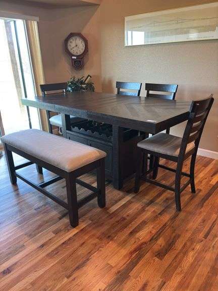Dining table with 1-20” leaf, table with leaf in measures 80” long, has wine rack and under storage cabinet, bench with storage, 4 chairs image